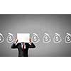Unrecognizable businessman holding paper covering his face presenting money concept