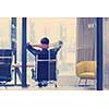 A time for relax. Young tired casual businessman relaxing at the desk in his office