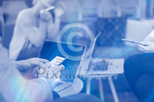 Young casual businessman using smartphone in the startup office Young casual businessman using smartphone in the startup office