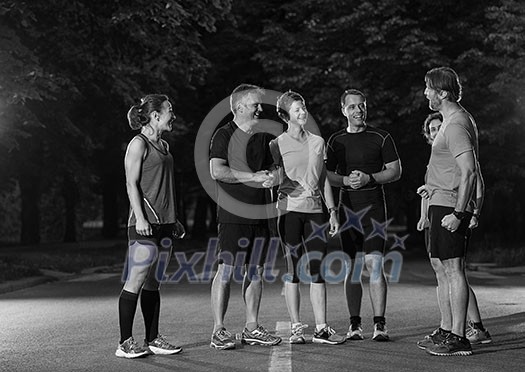 group of healthy people jogging in city park, runners team on morning training group of healthy people jogging in city park, runners team on morning training