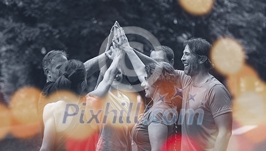 Group of healthy runners giving high five to each other while celebrating success after a training session. Group of healthy runners giving high five to each other while celebrating success after a training session.