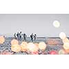 group of young friends spending day together running on the beach during autumn day