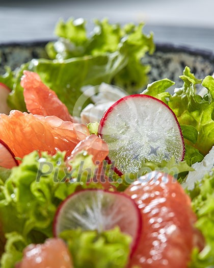 Homemade freshly salad from natural organic vegetables, fruits, cheese. Concept of healthy diet food. Close-up view with soft focus. Homemade freshly salad from natural organic vegetables, fruits, cheese. Concept of healthy diet food. Close-up view with soft focus.