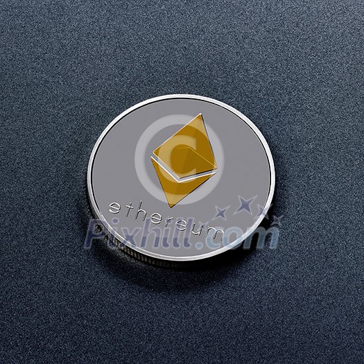 Silver Ethereum coin with a golden symbol represented on a dark background. Conceptual image for worldwide cryptocurrency and digital payment system. Top view Silver Ethereum coin with a golden symbol represented on a dark background. Conceptual image for worldwide cryptocurrency and digital payment system. Top view