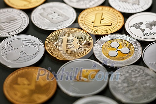 LTC, ETH, BTC, XMR, XRP gold and silver coins, crypto currency. Pattern of coins on a dark background. Business concept. Top view LTC, ETH, BTC, XMR, XRP gold and silver coins, crypto currency. Pattern of coins on a dark background. Business concept. Top view