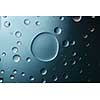 blue big and and small water drops on the glass blue gradient background
