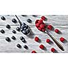 Sweet berries pattern from organic ripe fresh bluberry and raspberry on gray background. Healthy clean eating. Flat lay