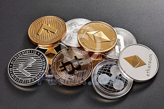Gold and silver coins of various crypto-currencies on a dark background. Cryptocurrency and blockchain concept. Gold and silver coins of various crypto-currencies on a dark background. Cryptocurrency and blockchain concept.