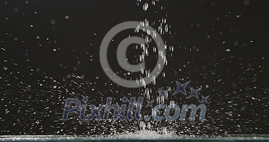 Running water falls from above on a flat surface with splashes and droplets of water, scattering in different directions against a black background. Slow motion. Full HD video, 240fps, 1080p Running water falls from above on a flat surface with splashes and droplets of water, scattering in different directions against a black background. Slow motion. Full HD video, 240fps, 1080p