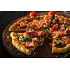 Delicious homemade fresh pizza with shrimps and bacon. Close-up.