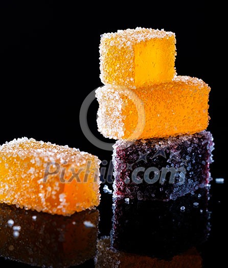 Fresh delicious juicy home made marmalade on a black background Fresh delicious juicy home made marmalade on a black background