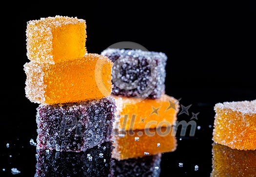 Fresh delicious juicy home made marmalade on a black background Fresh delicious juicy home made marmalade on a black background