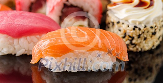Sushi with salmon. Close-up. Macro shooting. Sushi with salmon. Close-up. Macro shooting.