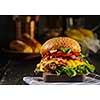 Homemade juicy burger with beef, bacon, cheese and bulgarian pepper. Street food, fast food.