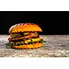 Fresh juicy delicious homemade burger. Hamburger with meat and fresh herbs.