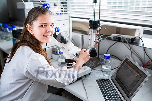 Portrait of a female chemistry student carrying out research in a chemistry lab (color toned image; shallow DOF) Portrait of a female chemistry student carrying out research in a chemistry lab (color toned image; shallow DOF)