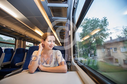 Young woman traveling by train Young woman traveling by train