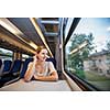 Young woman traveling by train
