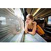 Young woman traveling by train