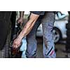 Wheel balancing or repair and change car tire at auto service garage or workshop by mechanic