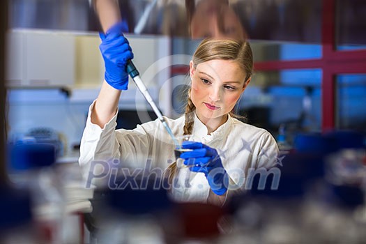 Portrait of a female researcher carrying out research in a chemistry lab (color toned image; shallow DOF) Portrait of a female researcher carrying out research in a chemistry lab (color toned image; shallow DOF)