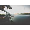 Man driving a car moving fast on a highway (motion blurred image)