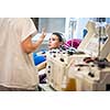Young woman giving blood in a modern hospital