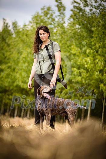 Autumn hunting season. Hunting. Outdoor sports. Woman hunter in the woods Autumn hunting season. Hunting. Outdoor sports. Woman hunter in the woods