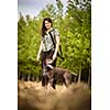 Autumn hunting season. Hunting. Outdoor sports. Woman hunter in the woods