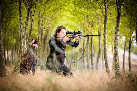 Autumn hunting season. Hunting. Outdoor sports. Woman hunter in the woods Autumn hunting season. Hunting. Outdoor sports. Woman hunter in the woods
