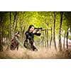 Autumn hunting season. Hunting. Outdoor sports. Woman hunter in the woods