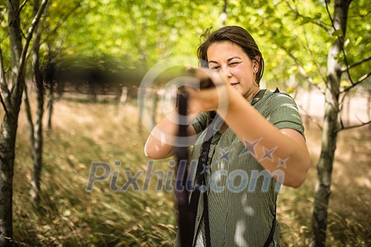 Autumn hunting season. Hunting. Outdoor sports. Woman hunter in the woods Autumn hunting season. Hunting. Outdoor sports. Woman hunter in the woods