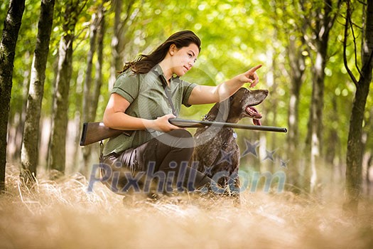 Autumn hunting season. Hunting. Outdoor sports. Woman hunter in the woods Autumn hunting season. Hunting. Outdoor sports. Woman hunter in the woods