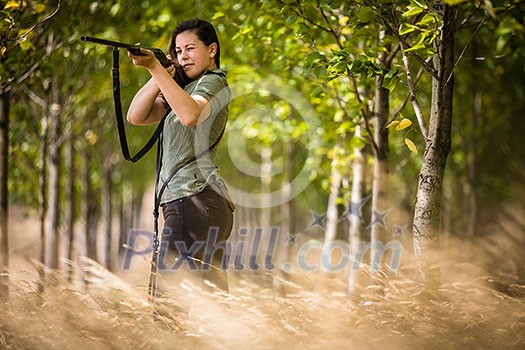 Autumn hunting season. Hunting. Outdoor sports. Woman hunter in the woods Autumn hunting season. Hunting. Outdoor sports. Woman hunter in the woods