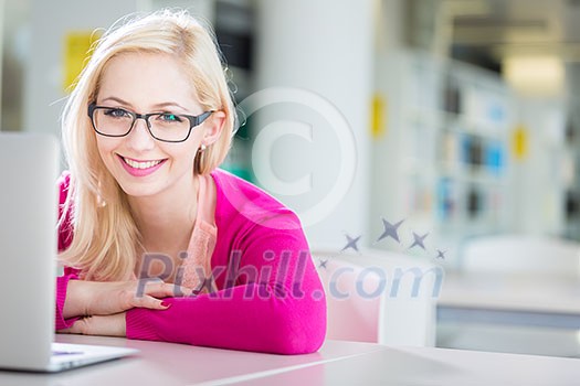 Pretty young college student in a library (shallow DOF; color toned image) Pretty young college student in a library (shallow DOF; color toned image)
