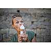 Woman eating ice cream outside on summer vacation in holiday beach resort.