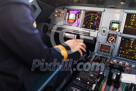 Pilot's hand accelerating on the throttle in  a commercial airliner airplane flight cockpit during takeoff