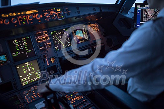 Pilot's hand accelerating on the throttle in a commercial airliner airplane flight cockpit during takeoff Pilot's hand accelerating on the throttle in a commercial airliner airplane flight cockpit during takeoff