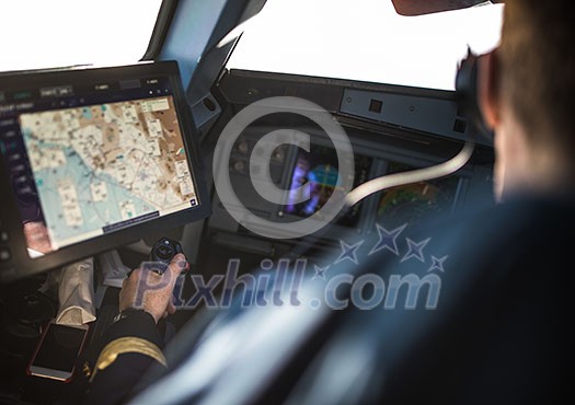 Pilot's hand accelerating on the throttle in a commercial airliner airplane flight cockpit during takeoff Pilot's hand accelerating on the throttle in a commercial airliner airplane flight cockpit during takeoff