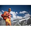 Pretty, female hiker/climber in a lovely alpine setting of Swiss Alps