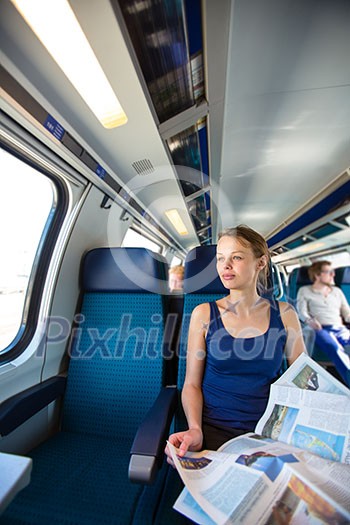 Young woman traveling by train Young woman traveling by train