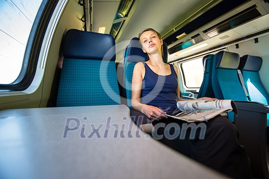 Young woman traveling by train Young woman traveling by train