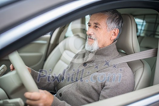 Senior man driving his modern car, going in reverse, watching out not to hit anything or anyone (color toned image; shallow DOF) Senior man driving his modern car, going in reverse, watching out not to hit anything or anyone (color toned image; shallow DOF)