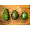 Avocados on a wooden kitchen table