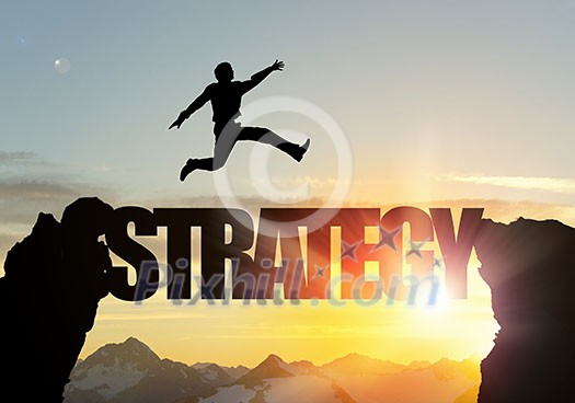 Businessman running on strategy word bridge over precipice Businessman running on strategy word bridge over precipice