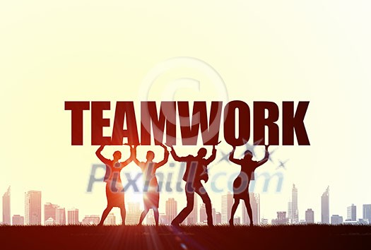 Business people lifting word teamwork representing collaboration concept Business people lifting word teamwork representing collaboration concept
