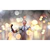 Young handsome businessman with hands up celebrating success