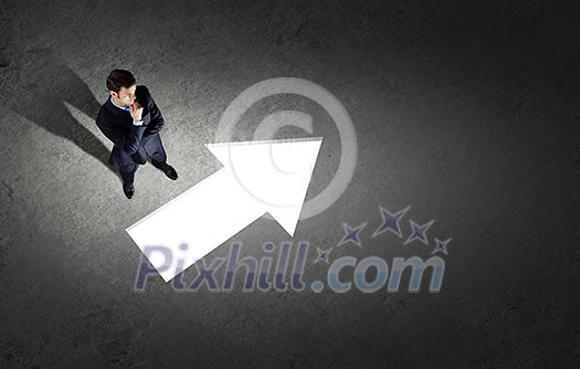 Top view of businessman looking at business sketches on floor Top view of businessman looking at business sketches on floor