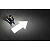 Top view of businessman looking at business sketches on floor