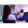 handsome mature teacher and students in computer lab classroom
